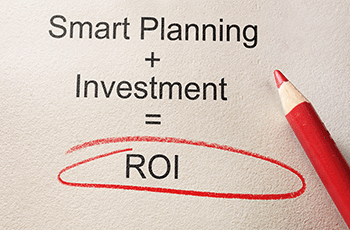 writing on paper smart planning plus investment equals return on investment